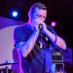 THE VOICE BETWEEN THE WORDS: PADDY SMITH’S HARMONICA IS THE OTHER LEAD SINGER